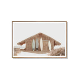Relaxed surf cabin coastal canvas print in a wood floating frame