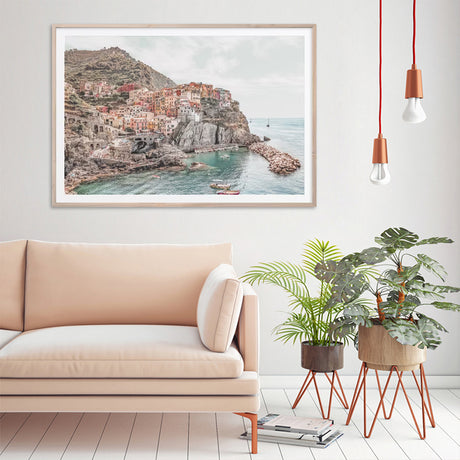 Wood framed Cinque Terre canvas print styled above a dining table
