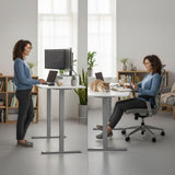 Turner white electric standing desk with silver frame in a home office