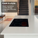 Ceramic cooktop installed flush in a kitchen benchtop with pots on two zones
