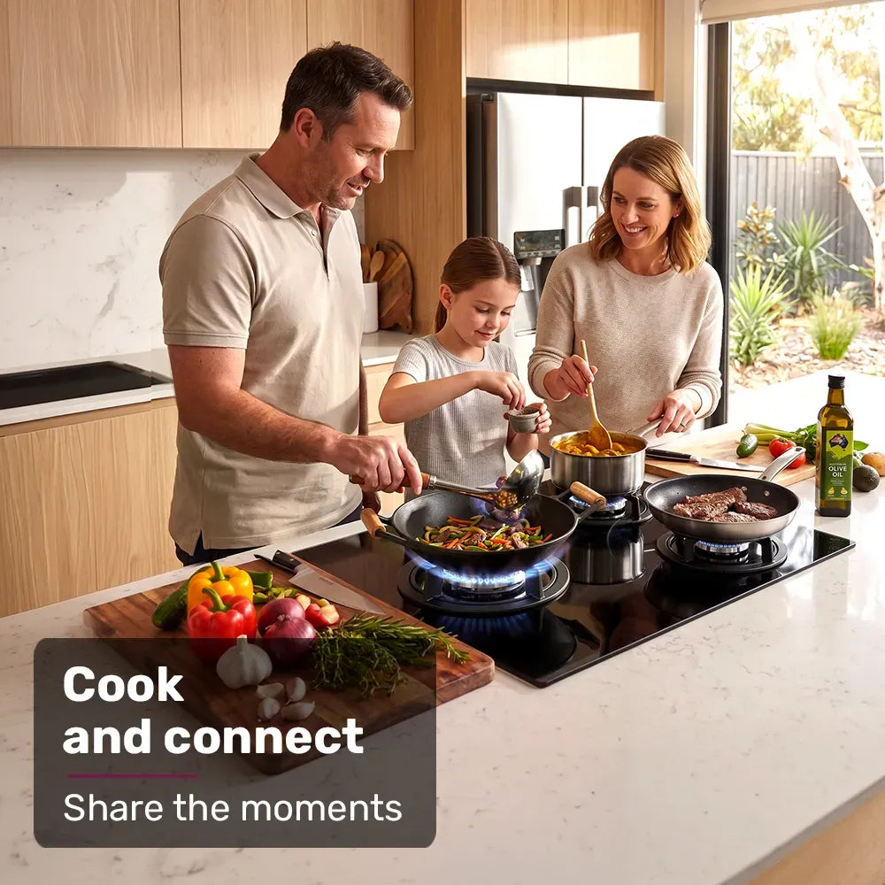 Gas cooktop installed in a kitchen benchtop with burners alight