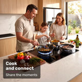 Gas cooktop installed in a kitchen benchtop with burners alight