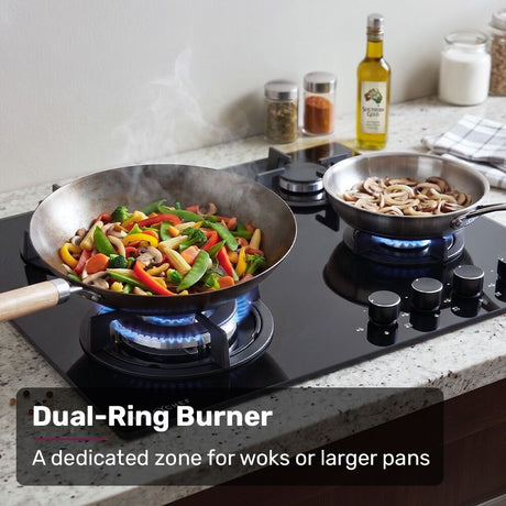 Overhead view of the four burner gas cooktop showing the central wok burner