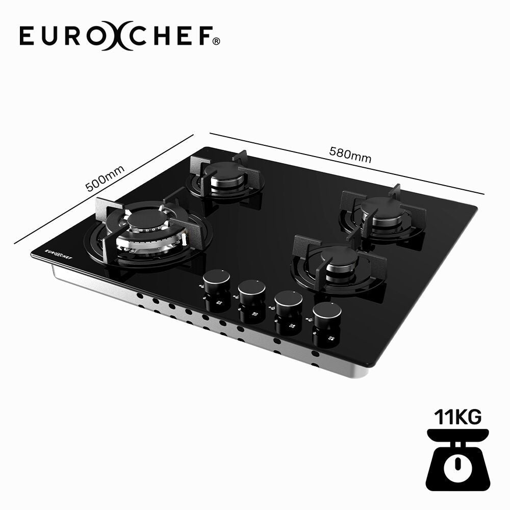 Cast iron trivets lifted off the black tempered glass gas cooktop for cleaning