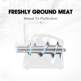 Food pusher feeding meat into the grinder feeding tray