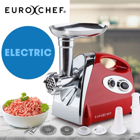 Electric meat grinder in red, front view showing feeding tray and grinding head