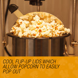 Popcorn machine on a bench with a bowl of freshly popped popcorn