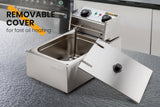 Hinged oil heating plate lifted clear of the deep fryer tank