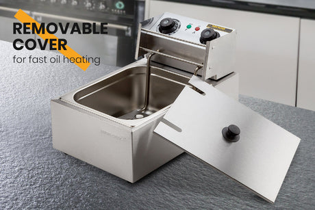 Hinged oil heating plate lifted clear of the deep fryer tank