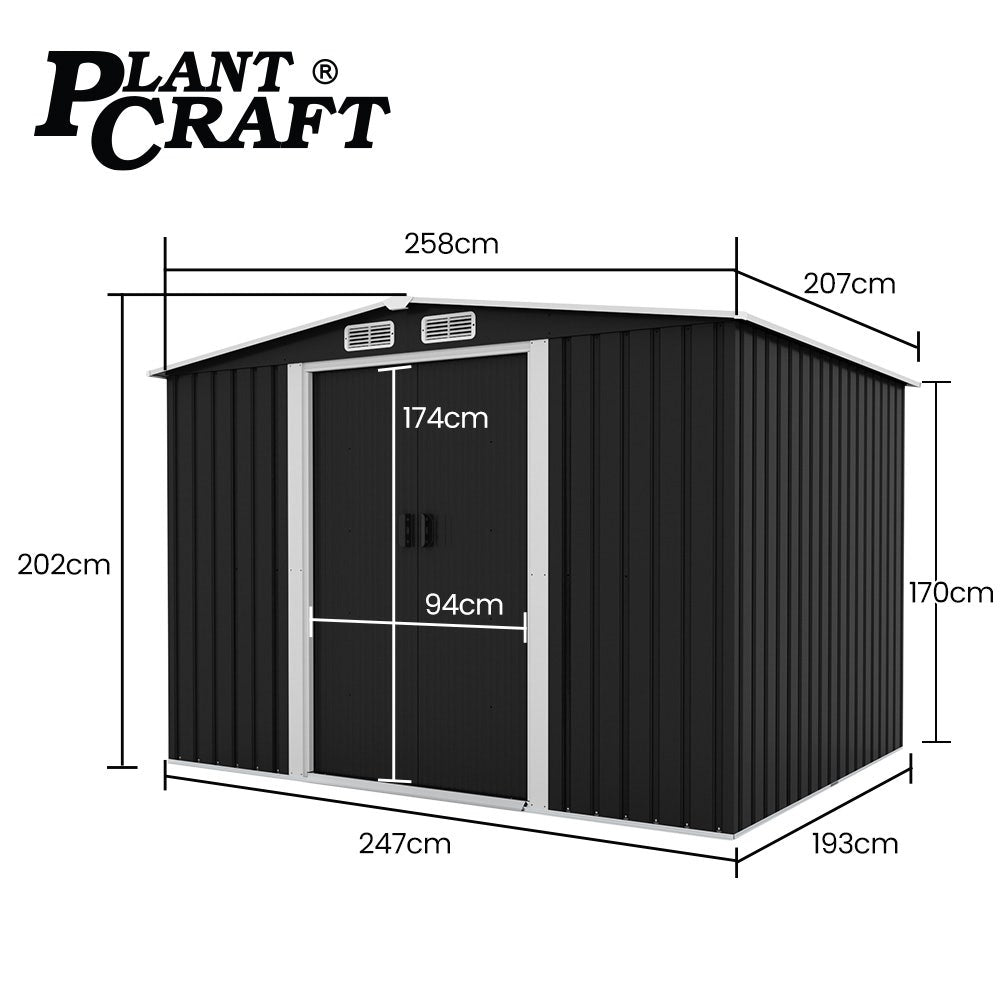 Black steel garden shed in backyard setting