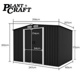Black steel garden shed in backyard setting