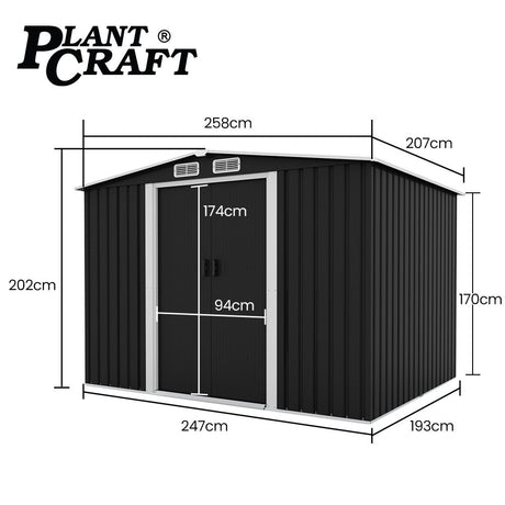 Black steel garden shed in backyard setting