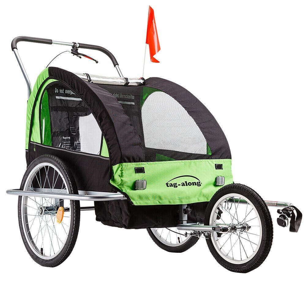 Green convertible kids bike trailer and jogger with clear canopy