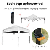 White folding gazebo shading an outdoor wedding or market style setup