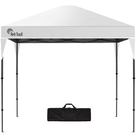 White 3 x 3 m pop up gazebo set up outdoors with open sides and a peaked canopy roof