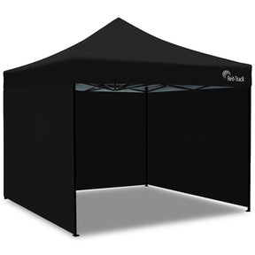 Black 3 x 3 m heavy duty pop up gazebo set up outdoors, front view