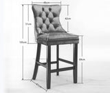 Ranelagh black velvet bar stool with silver stud trim and wooden legs in a dining room