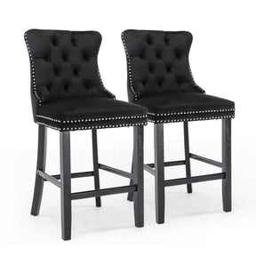 Sandy Point black velvet bar stools pair with silver stud trim and wooden legs