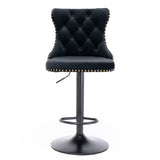 Kilcunda black velvet tufted swivel bar stool with nailhead trim in a modern kitchen
