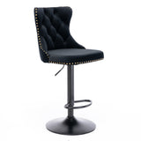 Kilcunda black velvet tufted swivel bar stool with nailhead trim in a modern kitchen