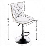 Kilcunda black velvet tufted swivel bar stool with nailhead trim in a modern kitchen