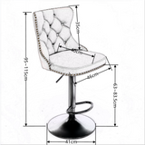 Four velvet nailhead bar stools in contemporary dining space — Allure Home Collections