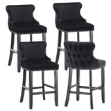 Silverleaves button tufted velvet bar stool black in a modern kitchen