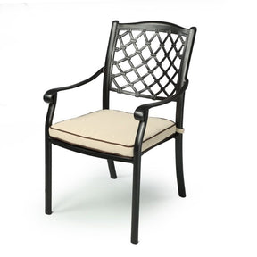 Wandandian black cast aluminium outdoor dining chair with cream cushion in a garden