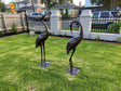Two piece cast aluminium garden crane statue set in dark bronze