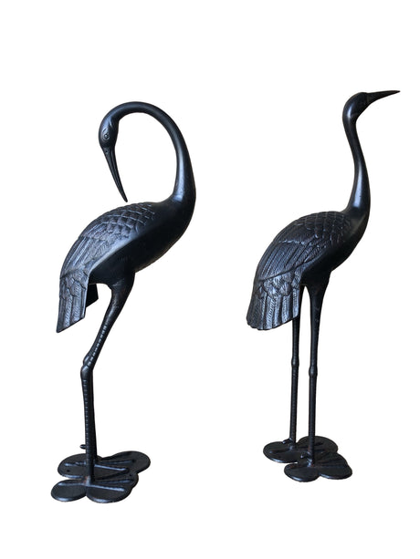 Male and female garden crane statues