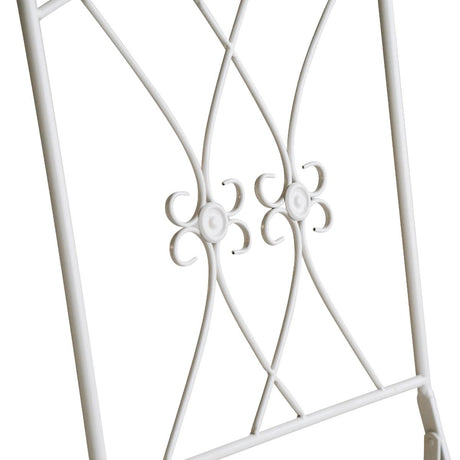 White iron outdoor bistro set arranged on a patio