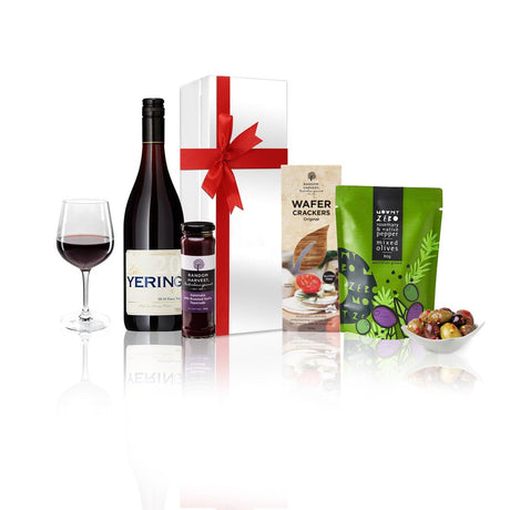 Pinot Noir and Gourmet Treats Gift Hamper in a white box with a red bow