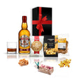 Beaujolais whisky and snacks gift hamper of premium Scotch whisky with popcorn, nougat, and pretzels in a black hamper box with red bow