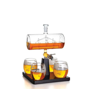Bruenig 1L globe whisky decanter with sailboat detail, four glasses and wooden stand