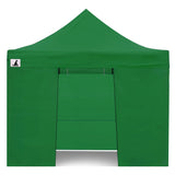 Zip up door panel of the green gazebo tied open for guests to walk through