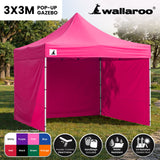 Side view of the pink folding marquee showing the valance and steel legs