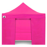 Zip up door panel of the pink gazebo tied open for guests to walk through