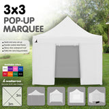 Side view of the white folding marquee showing the valance and steel legs