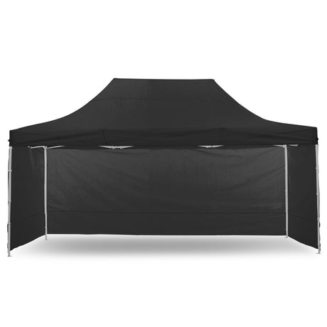 Black pop up gazebo 3 x 4.5 m set up on grass with the roof extended
