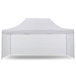 White pop up gazebo 3 x 4.5 m set up on grass with the roof extended