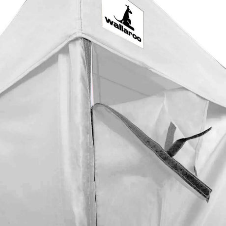 Half wall fitted along the 4.5 m side of the white gazebo at counter height