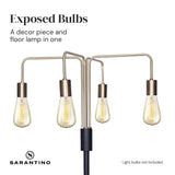 Industrial four arm floor lamp with exposed bulbs in antique brass and matte black