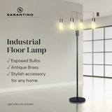 Industrial four arm floor lamp with exposed bulbs in antique brass and matte black