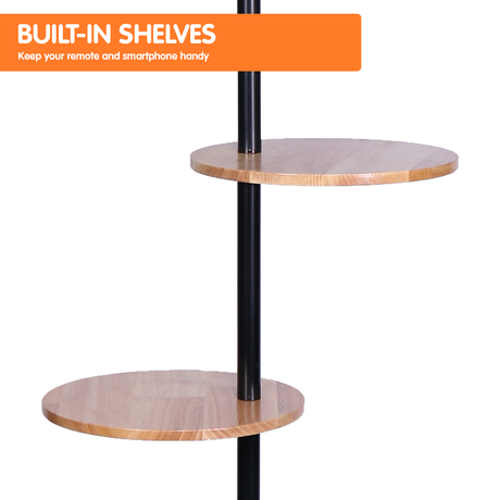 Metal floor lamp with round wood shelves and white drum shade