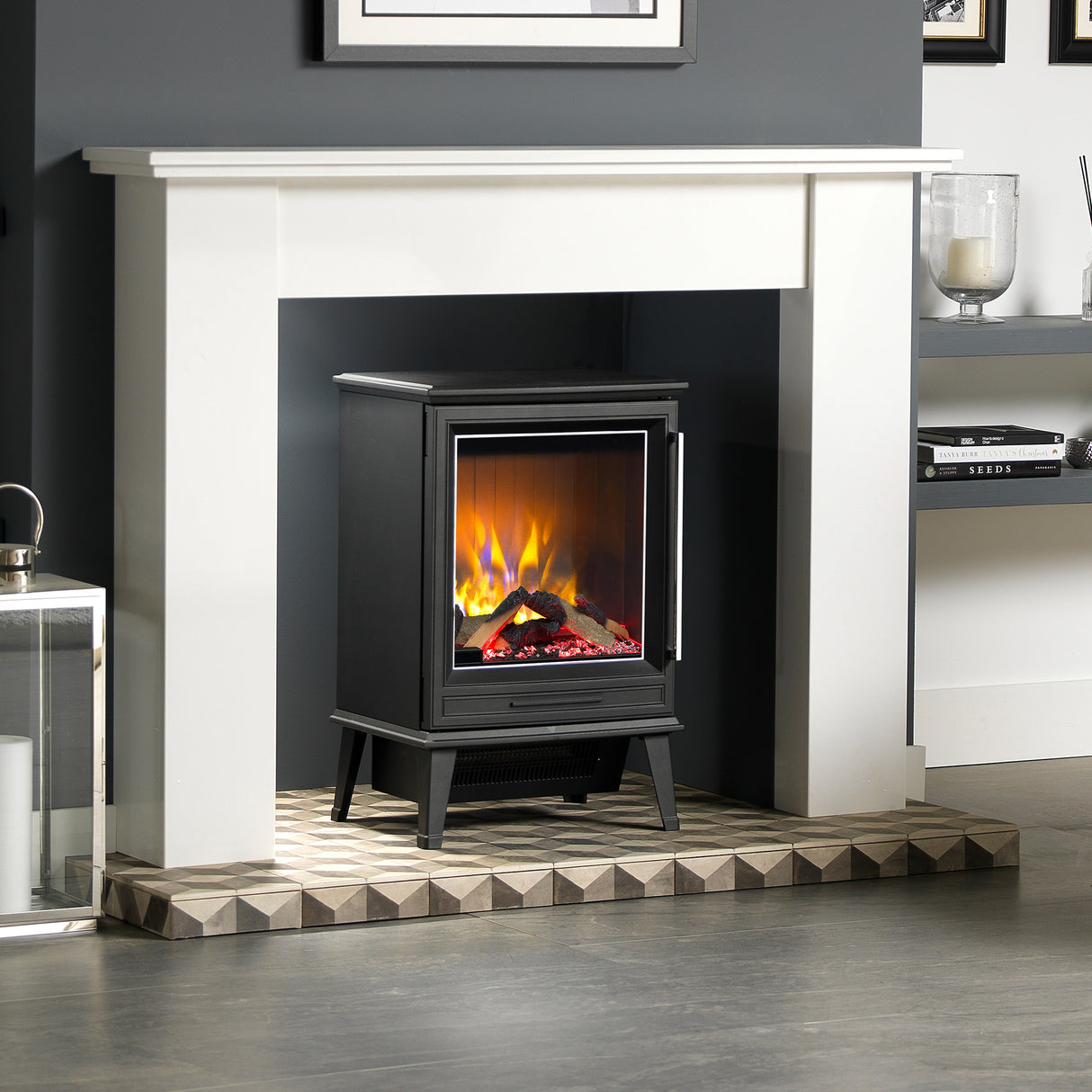 Electric fire stove styled in a rustic lounge room with the flame effect on