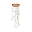 Monterosso gold spiral staircase chandelier cascading through a stairwell