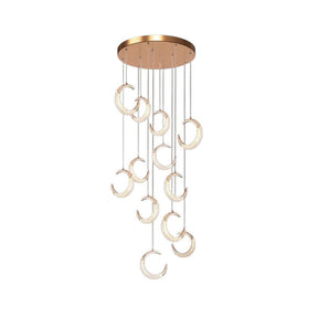 Monterosso gold spiral staircase chandelier cascading through a stairwell