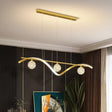 Portofino gold hand blown glass LED pendant above a dining table