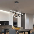 Vernazza black three ring LED chandelier above a living room