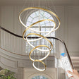 Vernazza gold five ring LED chandelier above a styled dining table